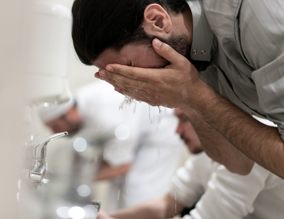 Muslim Man Performing Ablution  